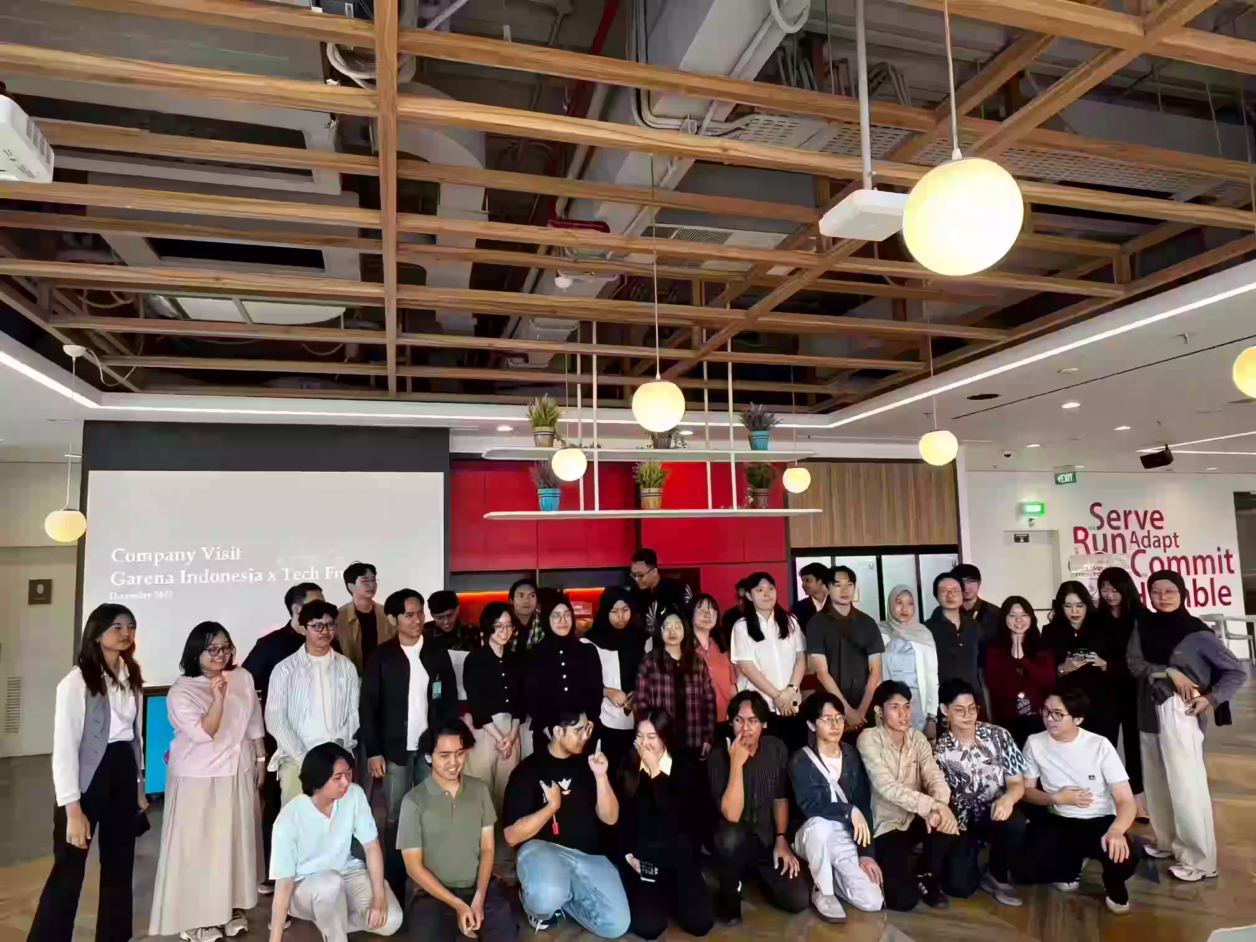 TechFusion community event with students collaborating on tech projects